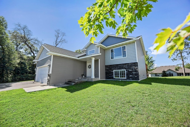 13143 Jefferson St, Becker, MN 55308 - view of front of house featuring stone siding, an attached garage, concrete driveway, and a front yard