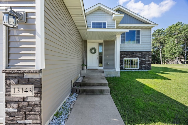 13143 Jefferson St, Becker, MN 55308 - view of front of home with stone siding and a front lawn