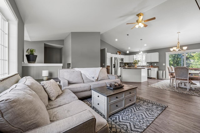 13143 Jefferson St, Becker, MN 55308 - living area with ceiling fan, lofted ceiling, dark wood-style flooring, a chandelier, and recessed lighting