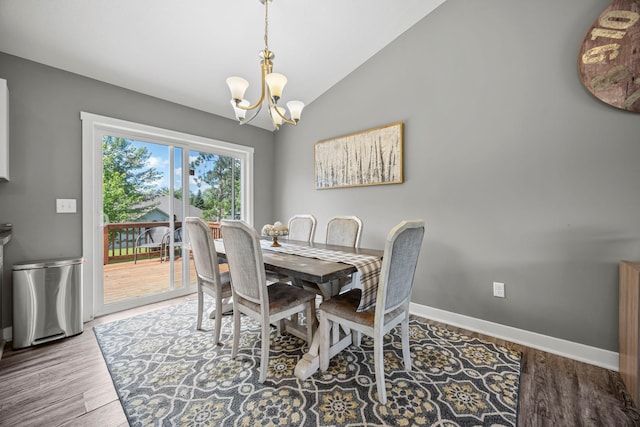 13143 Jefferson St, Becker, MN 55308 - dining space with a chandelier, vaulted ceiling, and wood finished floors