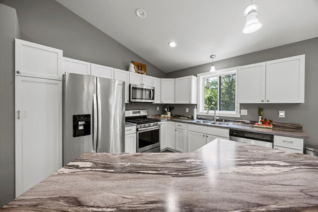 13143 Jefferson St, Becker, MN 55308 - kitchen featuring stainless steel appliances, lofted ceiling, white cabinetry, decorative light fixtures, and recessed lighting