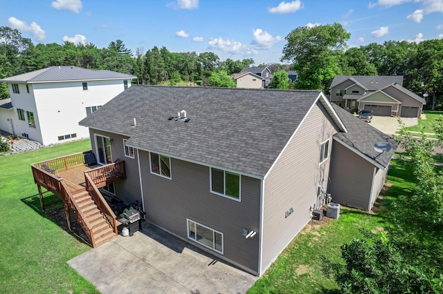 13143 Jefferson St, Becker, MN 55308 - back of house featuring a shingled roof, a patio, a deck, a yard, and stairway