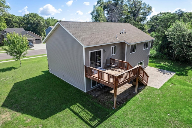 13143 Jefferson St, Becker, MN 55308 - rear view of house with a deck, a shingled roof, a yard, and a patio area