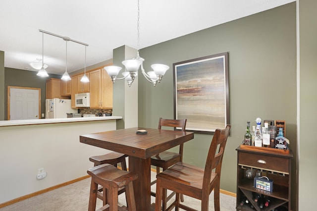 14301 Banyan Ln, Rosemount, MN 55068 - dining space with light carpet and a chandelier