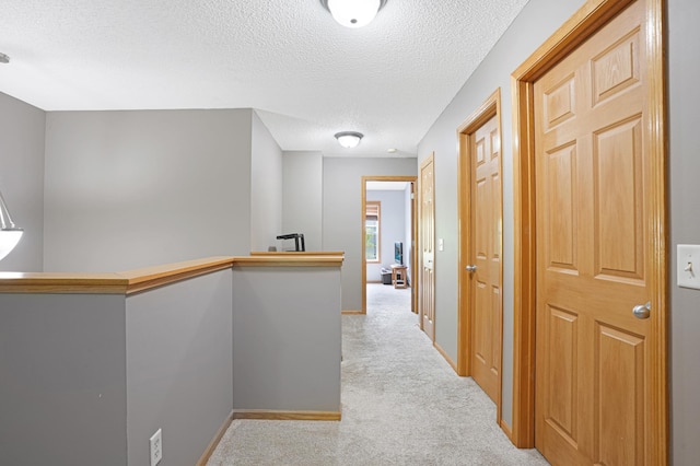 14301 Banyan Ln, Rosemount, MN 55068 - hall with carpet flooring, a textured ceiling, and an upstairs landing