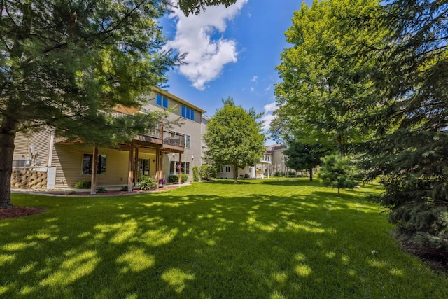 1254 129th Ln NW, Coon Rapids, MN 55448 - view of grassy yard featuring a deck