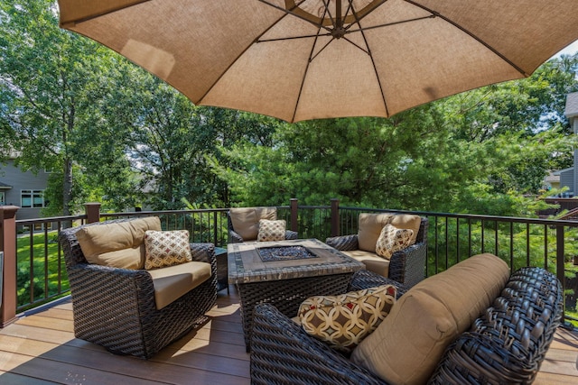 1254 129th Ln NW, Coon Rapids, MN 55448 - deck featuring an outdoor living space with a fire pit
