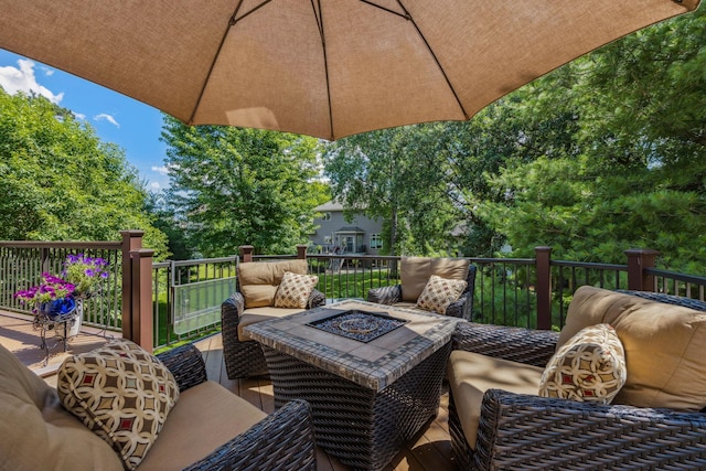 1254 129th Ln NW, Coon Rapids, MN 55448 - deck featuring an outdoor living space with a fire pit