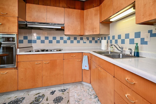 366 Kansas St, Winona, MN 55987 - kitchen with oven, ventilation hood, black stovetop, and light countertops
