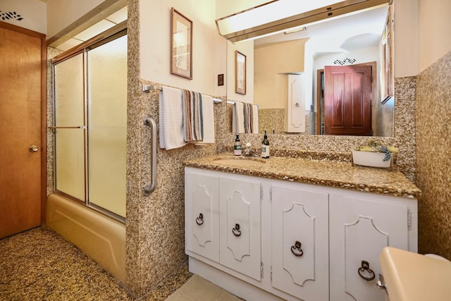 366 Kansas St, Winona, MN 55987 - bathroom featuring enclosed tub / shower combo, vanity, and tasteful backsplash