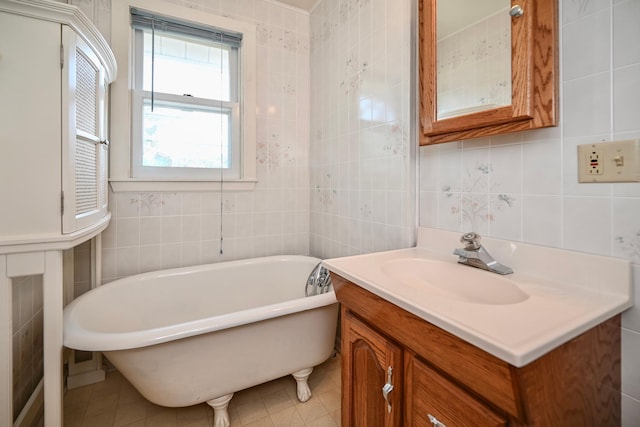 366 Kansas St, Winona, MN 55987 - bathroom featuring tile walls, a soaking tub, vanity, and tile patterned flooring