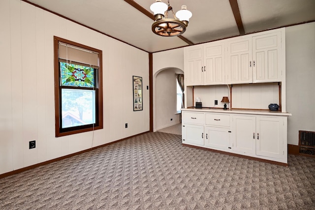 366 Kansas St, Winona, MN 55987 - kitchen with a chandelier, arched walkways, and carpet