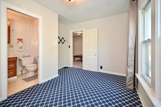 366 Kansas St, Winona, MN 55987 - unfurnished bedroom featuring ensuite bathroom and carpet floors
