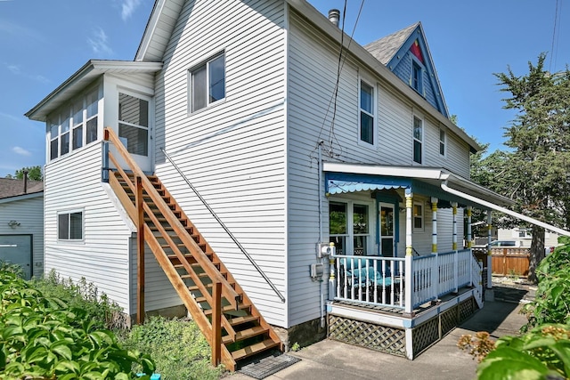 366 Kansas St, Winona, MN 55987 - rear view of house with stairway and a porch