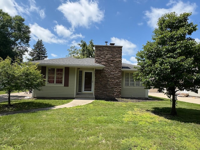 207 Meadow Ln, Benson, MN 56215 - view of front of home featuring a front yard and a chimney