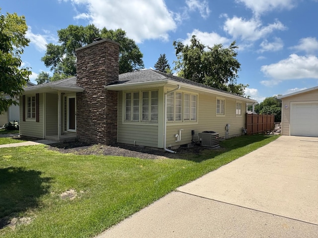 207 Meadow Ln, Benson, MN 56215 - view of home's exterior with a garage, a chimney, and driveway
