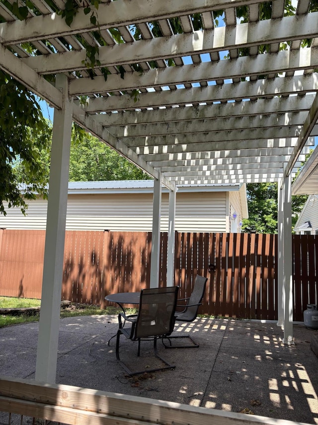 207 Meadow Ln, Benson, MN 56215 - fenced backyard with a pergola, a patio area, and outdoor dining space