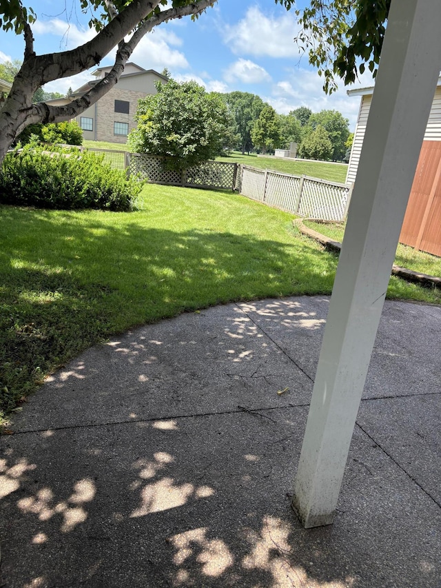 207 Meadow Ln, Benson, MN 56215 - fenced backyard with a patio area