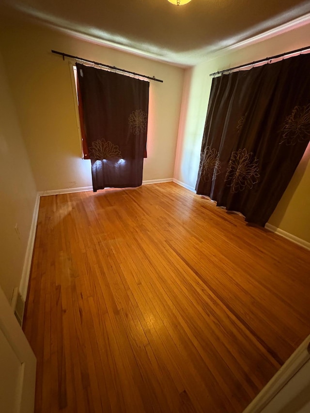 207 Meadow Ln, Benson, MN 56215 - empty room with wood finished floors and baseboards