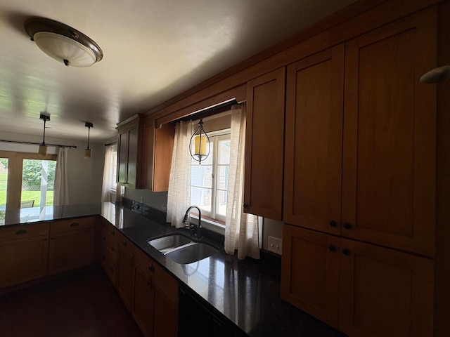 207 Meadow Ln, Benson, MN 56215 - kitchen featuring a peninsula, decorative light fixtures, brown cabinetry, and dark countertops