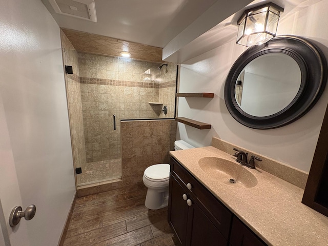 207 Meadow Ln, Benson, MN 56215 - bathroom featuring a stall shower, vanity, and wood finished floors