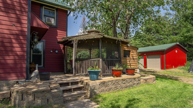 W13263 Hutchinson Rd, Big Bend Twp, WI 54819 - view of grassy yard featuring a gazebo, an outdoor structure, and a detached garage