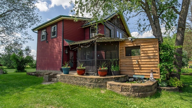 W13263 Hutchinson Rd, Big Bend Twp, WI 54819 - rear view of property featuring a yard and a sunroom