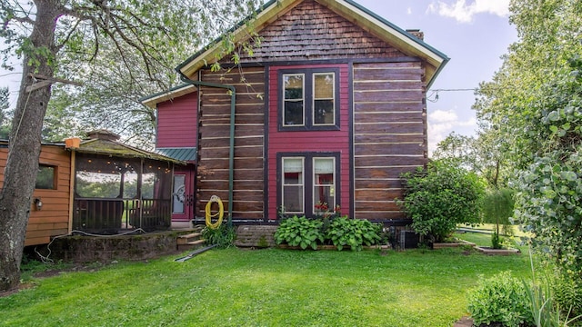 W13263 Hutchinson Rd, Big Bend Twp, WI 54819 - back of house with a lawn
