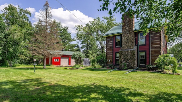 W13263 Hutchinson Rd, Big Bend Twp, WI 54819 - view of green lawn featuring an outbuilding
