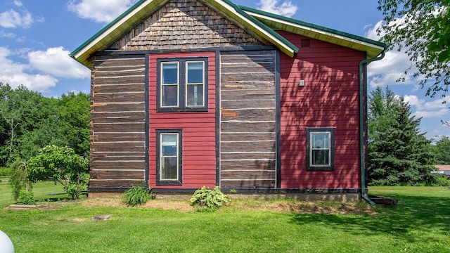 W13263 Hutchinson Rd, Big Bend Twp, WI 54819 - view of property exterior with a yard and an outbuilding