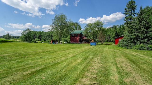 W13263 Hutchinson Rd, Big Bend Twp, WI 54819 - view of green lawn featuring an outbuilding