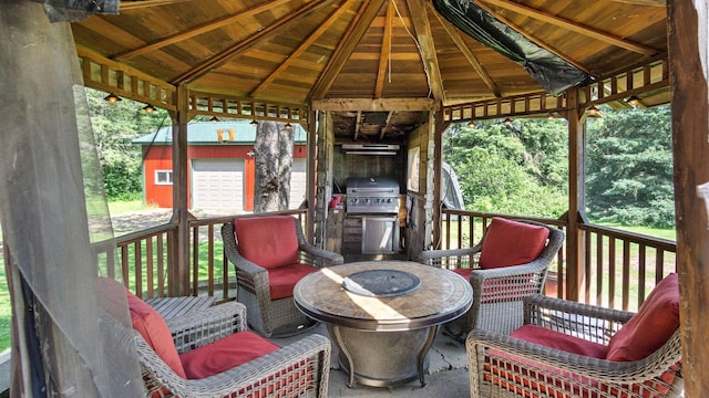 W13263 Hutchinson Rd, Big Bend Twp, WI 54819 - wooden deck featuring an outdoor structure and a grill
