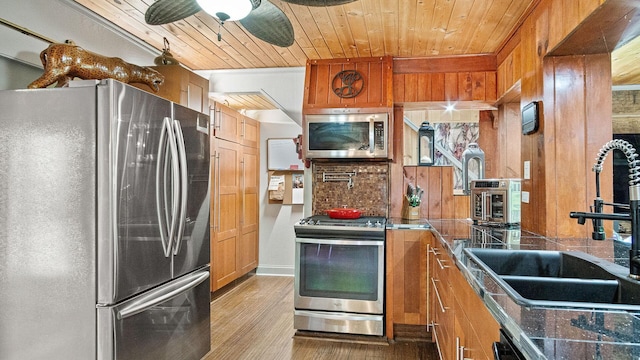 W13263 Hutchinson Rd, Big Bend Twp, WI 54819 - kitchen featuring appliances with stainless steel finishes, brown cabinetry, wood ceiling, a ceiling fan, and wood finished floors