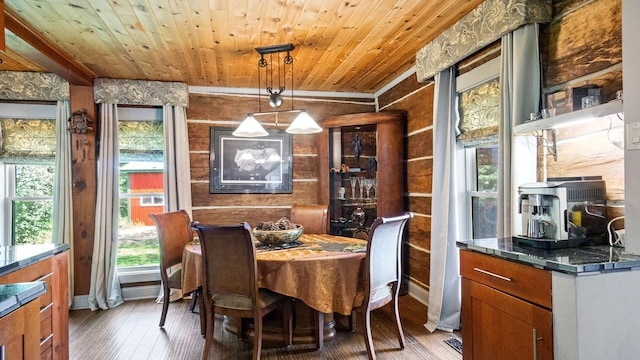 W13263 Hutchinson Rd, Big Bend Twp, WI 54819 - dining area featuring wood-type flooring, wooden ceiling, and crown molding