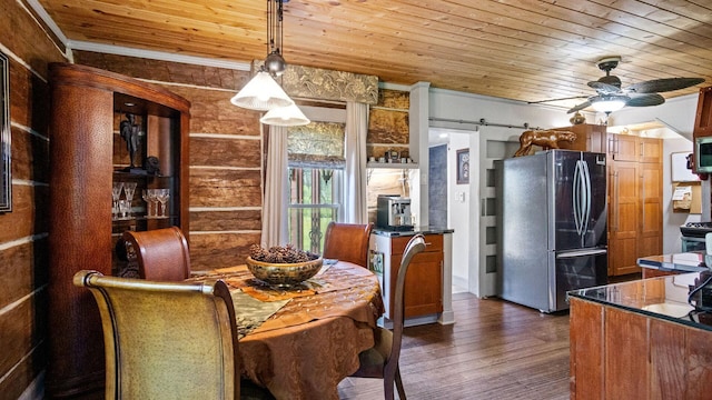 W13263 Hutchinson Rd, Big Bend Twp, WI 54819 - dining area with wood ceiling, dark wood finished floors, a ceiling fan, crown molding, and a barn door