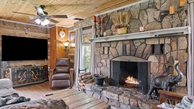 W13263 Hutchinson Rd, Big Bend Twp, WI 54819 - living area with wooden ceiling, a fireplace, ornamental molding, wood finished floors, and a ceiling fan