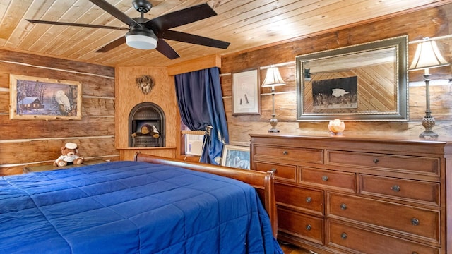 W13263 Hutchinson Rd, Big Bend Twp, WI 54819 - bedroom with wooden ceiling and wood walls