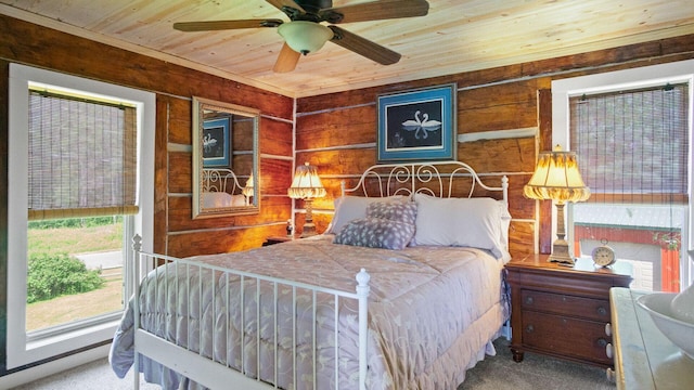 W13263 Hutchinson Rd, Big Bend Twp, WI 54819 - bedroom featuring carpet floors, wooden ceiling, and wood walls
