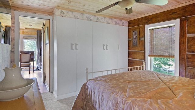 W13263 Hutchinson Rd, Big Bend Twp, WI 54819 - carpeted bedroom featuring wooden ceiling and ceiling fan