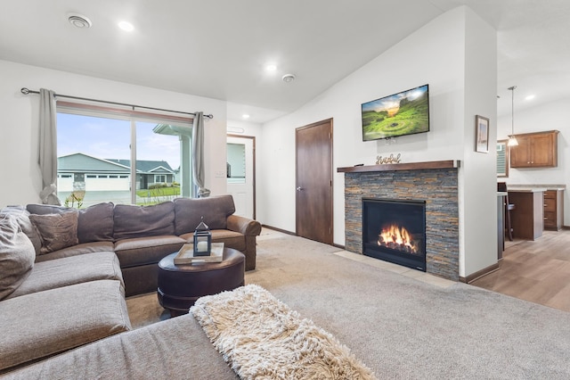 888 Tallgrass Ct, Wanamingo, MN 55983 - living area featuring vaulted ceiling, a fireplace, light colored carpet, and recessed lighting