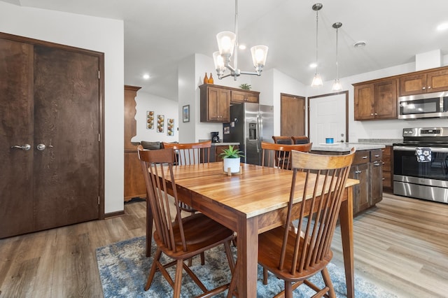 888 Tallgrass Ct, Wanamingo, MN 55983 - dining area with light wood-style flooring, lofted ceiling, a chandelier, and recessed lighting