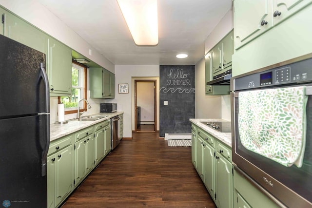 402 5th St NE, Barnesville, MN 56514 - kitchen featuring green cabinets, black appliances, and light countertops