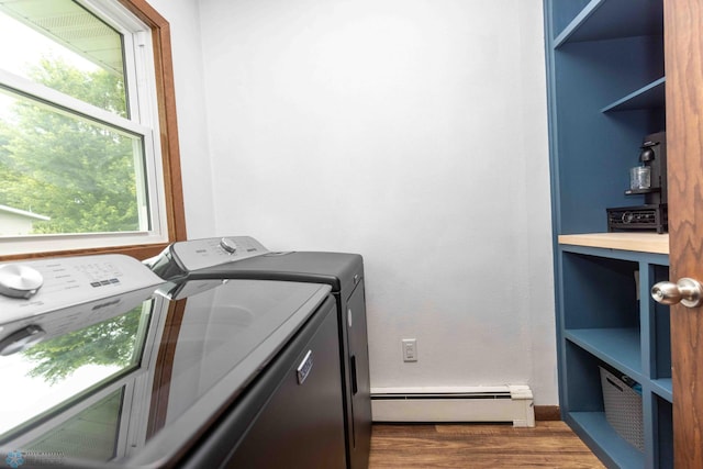 402 5th St NE, Barnesville, MN 56514 - laundry area featuring baseboard heating, washer and clothes dryer, and wood finished floors