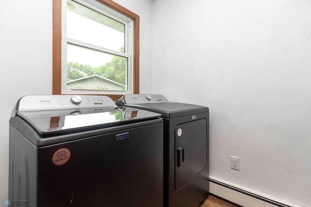 402 5th St NE, Barnesville, MN 56514 - laundry area featuring a baseboard heating unit and washer and dryer
