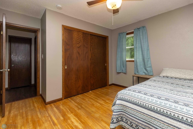 402 5th St NE, Barnesville, MN 56514 - bedroom featuring light wood-type flooring, a closet, and ceiling fan