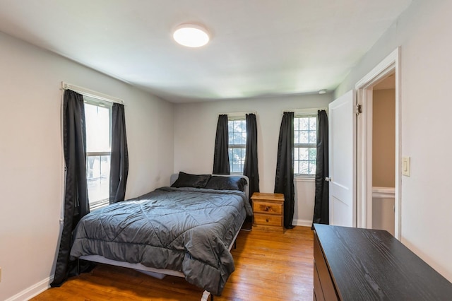 1290 Matilda St, Saint Paul, MN 55117 - bedroom with light wood-style flooring and baseboards