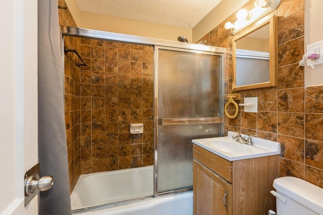 1290 Matilda St, Saint Paul, MN 55117 - bathroom with shower / bath combination with glass door, vanity, tile walls, and a textured ceiling