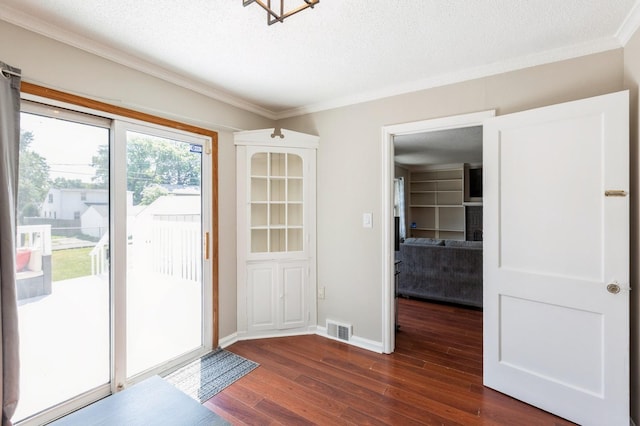 1290 Matilda St, Saint Paul, MN 55117 - doorway to outside featuring dark wood-style floors, ornamental molding, and a textured ceiling