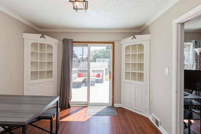 1290 Matilda St, Saint Paul, MN 55117 - doorway featuring a textured ceiling, dark wood-style floors, and ornamental molding
