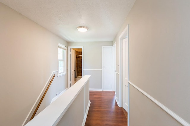 1290 Matilda St, Saint Paul, MN 55117 - hallway with an upstairs landing, a textured ceiling, and dark wood-style flooring